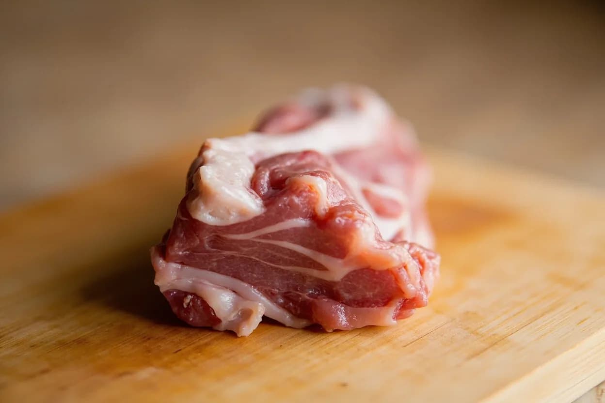 Gopchang (Small Intestine) in its raw whole-cut form on a butcher's board — Gopchang (곱창) refers specifically to the small intestine of beef (and occasionally pork, in which case it is usually called dwaeji gopchang 돼지곱창). Identifying traits: Dual texture: firm, snappy outer wall plus creamy, fat-rich inner mucosa, Distinctive rich, slightly sweet intestinal fat flavor when properly cleaned, Must be cleaned before cooking—uncleaned intestine has a sharp barnyard odor.