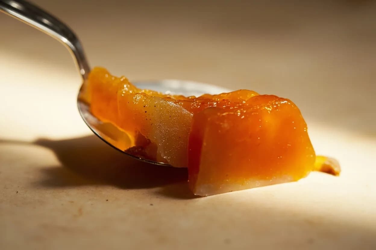 Aspic & Headcheese Gel Set Point at Sets below 15°C (59°F); optimal serving at 4–8°C (39–46°F). Gelatin is a mixture of collagen-derived proteins. Visual cues: Chilled spoonful of cooled stock trembles like firm jelly and peels from a spoon when tipped — gel has set, Surface of headcheese mould is matte and opaque, not shiny and liquid, after 4+ hours refrigeration, Sliced aspic holds a clean edge and does not weep or puddle at room temperature for at least 5–10 minutes.